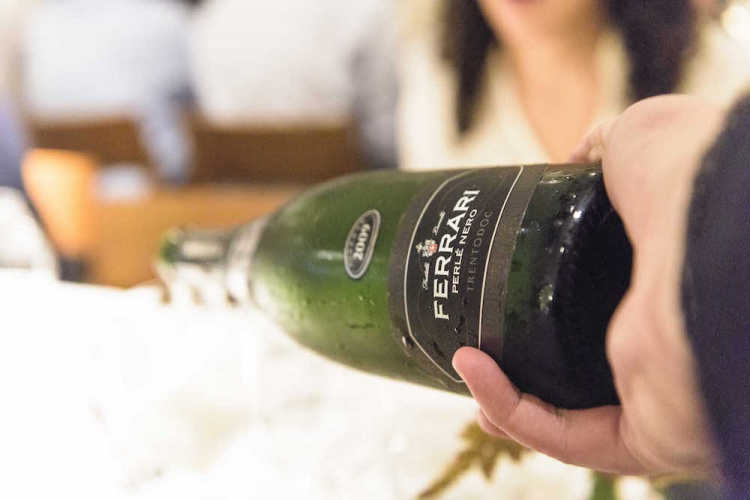In the glasses, bubbles by Cantine Ferrari