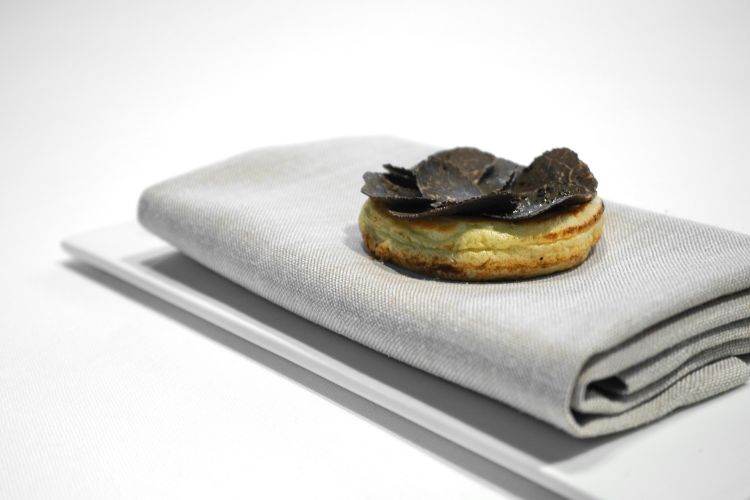 Blini filled with liquid foie gras and pigeon and black truffle