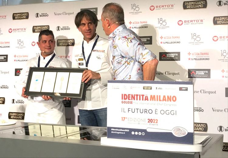 Handing the iconic Identità Milano plate to Davide Oldani